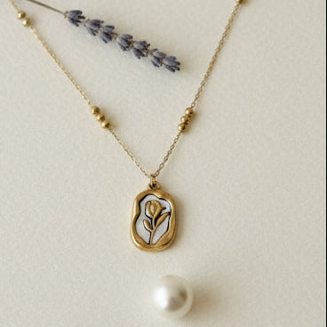 Collage of pearl necklaces on a neutral background
